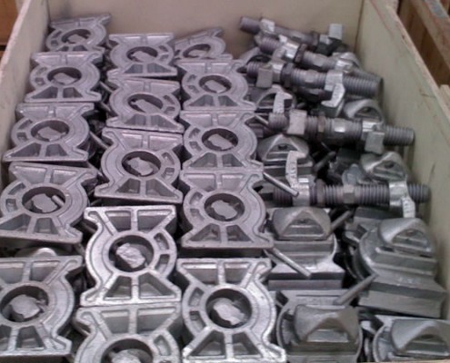 weldable twist locks and bridge clamps